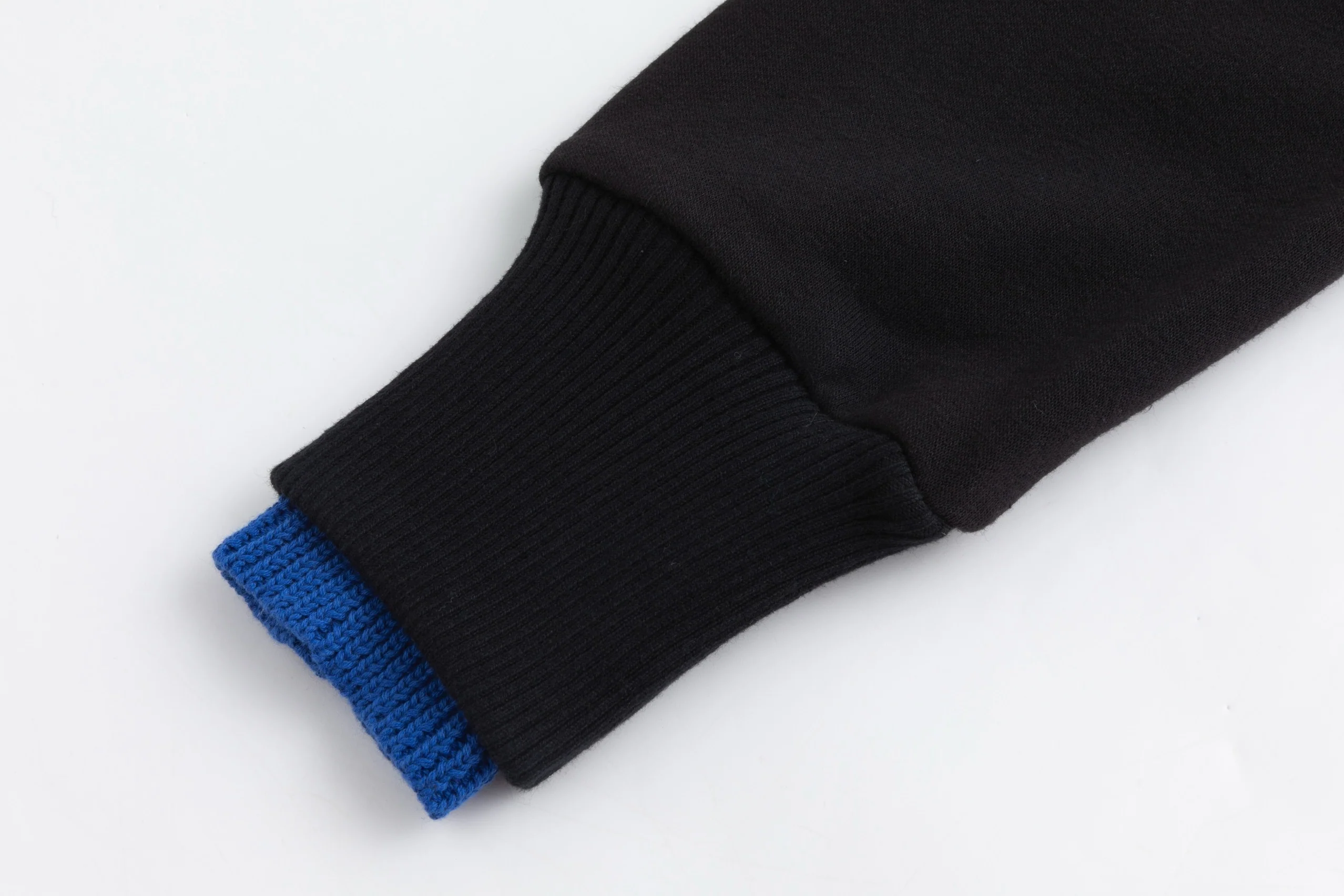 Black Sweater With Green And Blue Knit Pocket Details - Image 7