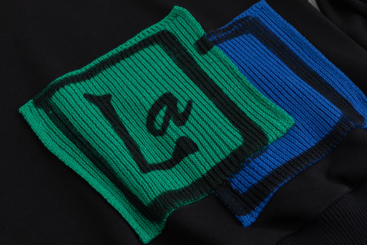 Black Sweater With Green And Blue Knit Pocket Details - Image 8