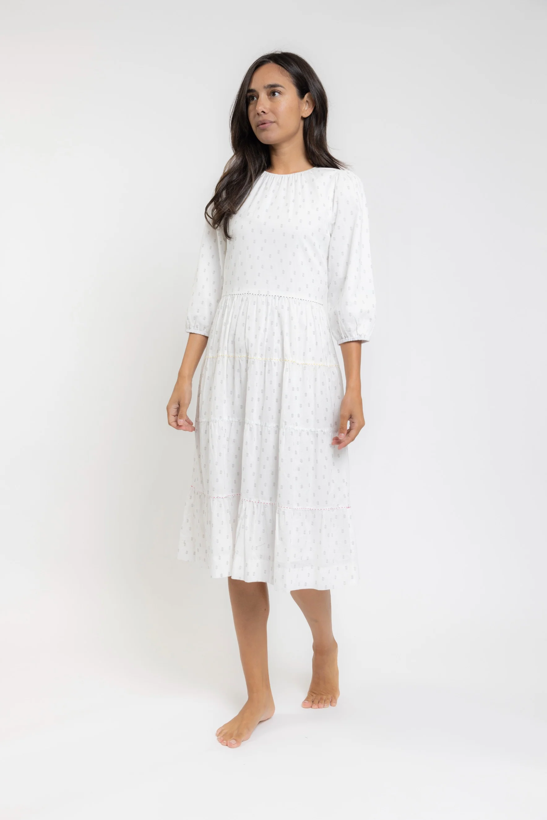 White Dress With Black Print And Colored Exposed Stitching On Tiers